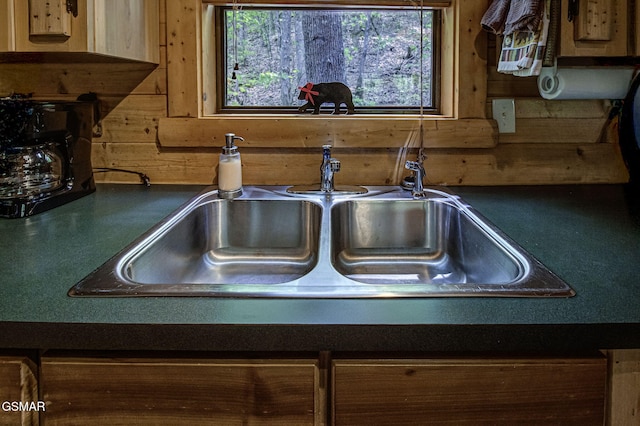 3050 Headrick Dr, Sevierville, TN 37862 - interior details featuring a sink, dark countertops, and wood walls