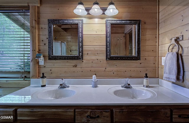 3050 Headrick Dr, Sevierville, TN 37862 - full bath with double vanity, a sink, and wooden walls