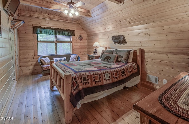 3050 Headrick Dr, Sevierville, TN 37862 - bedroom featuring wood ceiling, visible vents, wood walls, lofted ceiling, and hardwood / wood-style floors
