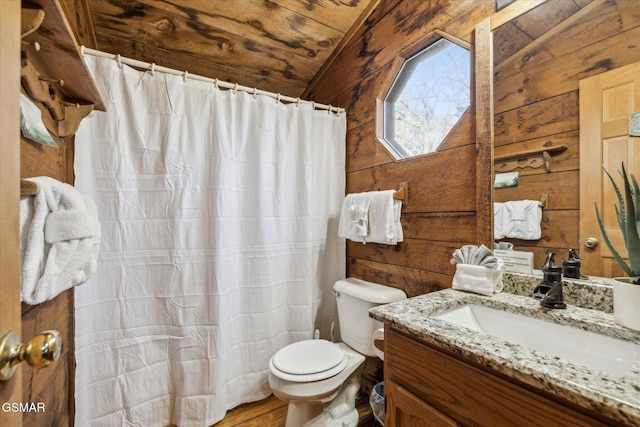 full bath with wooden walls, vanity, toilet, wood finished floors, and lofted ceiling