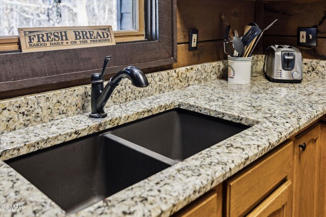 interior details featuring a sink