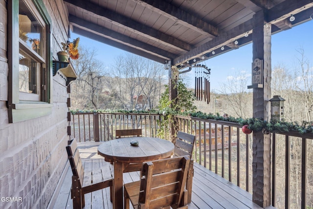deck featuring outdoor dining area
