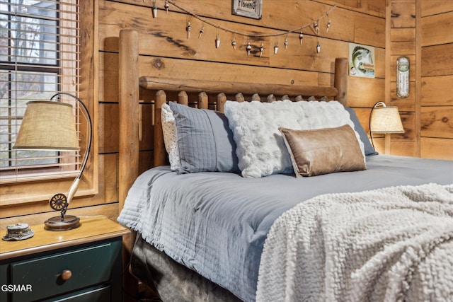bedroom with wooden walls