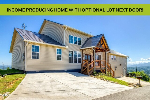 810 Oakley Way, Gatlinburg, TN 37738 - back of house with crawl space, metal roof, a standing seam roof, and a mountain view