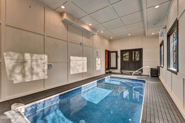 pool featuring an AC wall unit