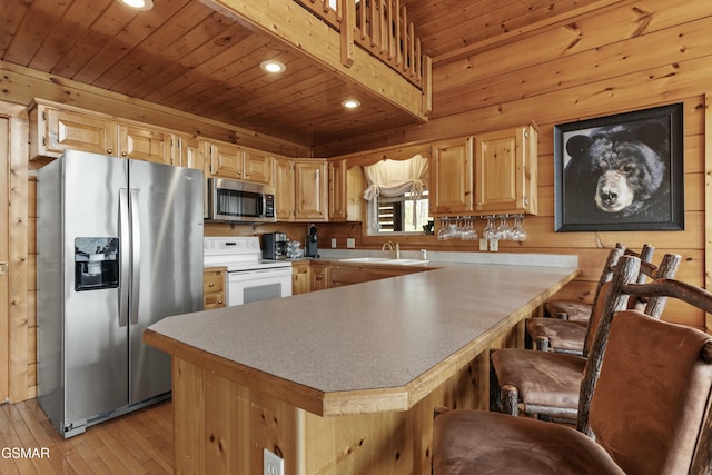 2851 Indigo Ln, Sevierville, TN 37862 - kitchen with a sink, wood ceiling, stainless steel appliances, light wood-style flooring, and recessed lighting