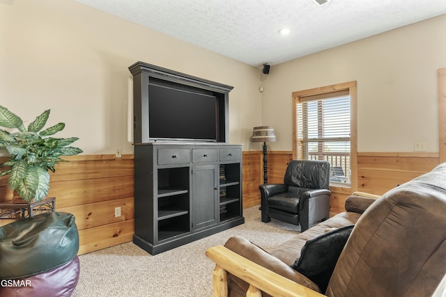 2851 Indigo Ln, Sevierville, TN 37862 - living room featuring light carpet, a wainscoted wall, wood walls, and a textured ceiling