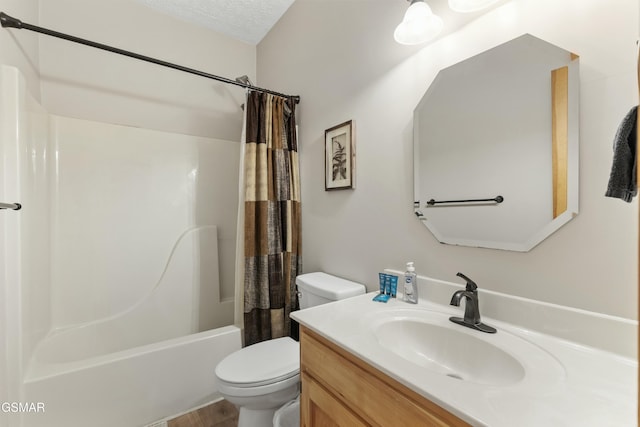 2851 Indigo Ln, Sevierville, TN 37862 - bathroom featuring wood finished floors, a textured ceiling, vanity, shower / tub combo with curtain, and toilet