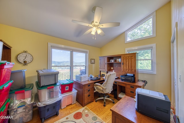 office area featuring lofted ceiling, light wood-style floors, and ceiling fan