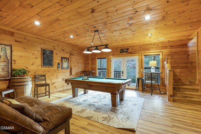 playroom featuring french doors, wood walls, light hardwood / wood-style floors, wood ceiling, and pool table