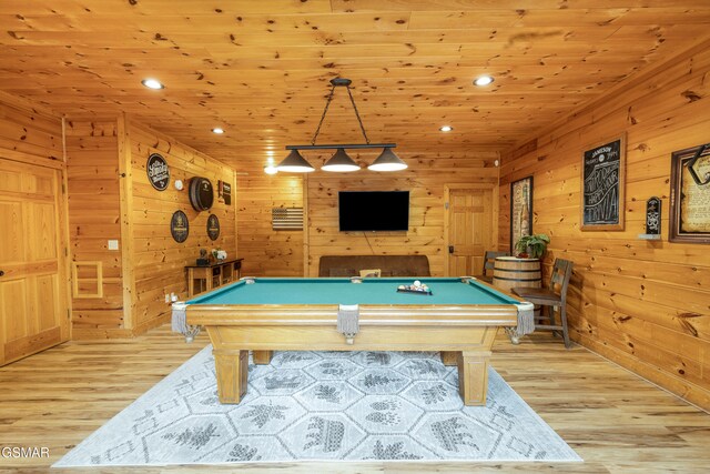 rec room with wood walls, light hardwood / wood-style flooring, wooden ceiling, and pool table