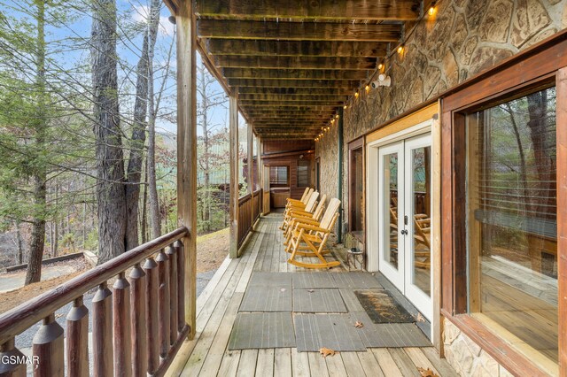 wooden terrace featuring french doors