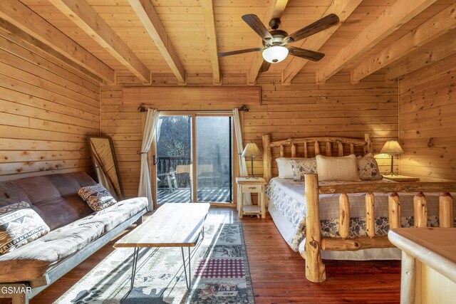 bedroom with wood ceiling, access to outside, wooden walls, beamed ceiling, and dark hardwood / wood-style floors