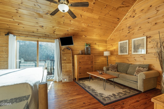 living room with hardwood / wood-style floors, lofted ceiling, wood walls, and wood ceiling