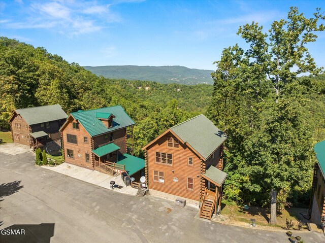 birds eye view of property with a wooded view