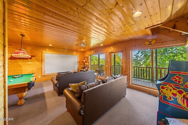 playroom featuring wooden walls, wooden ceiling, and carpet flooring