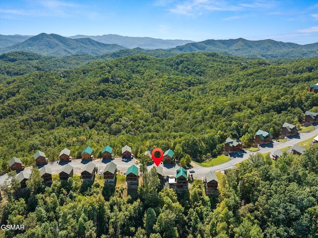 aerial view featuring a mountain view and a forest view