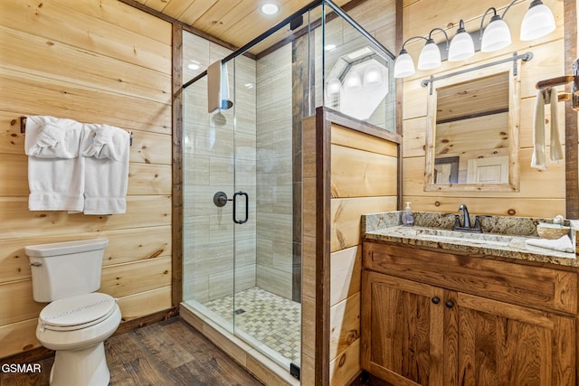 bathroom with toilet, wood-type flooring, walk in shower, and wooden walls