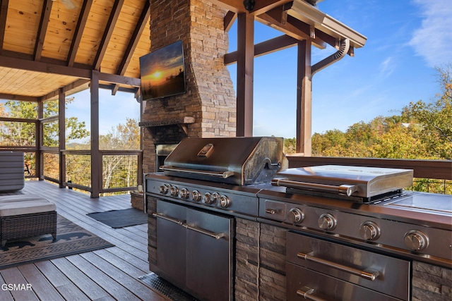 wooden deck featuring area for grilling