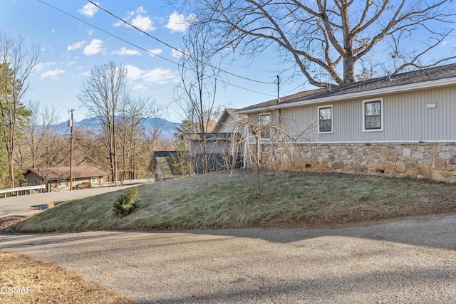 view of property exterior featuring stone siding