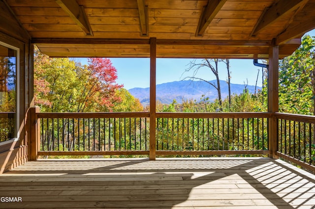 wooden terrace featuring a mountain view