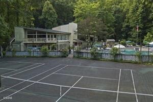 exterior space with tennis court