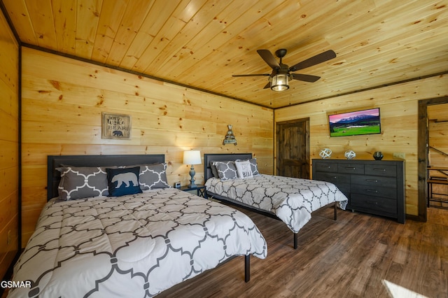 bedroom with wooden walls, ceiling fan, wood ceiling, and wood-type flooring