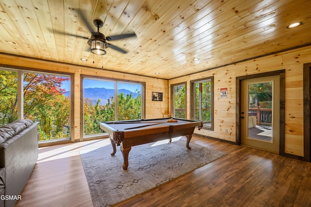 recreation room with a mountain view, billiards, light hardwood / wood-style flooring, ceiling fan, and wood ceiling