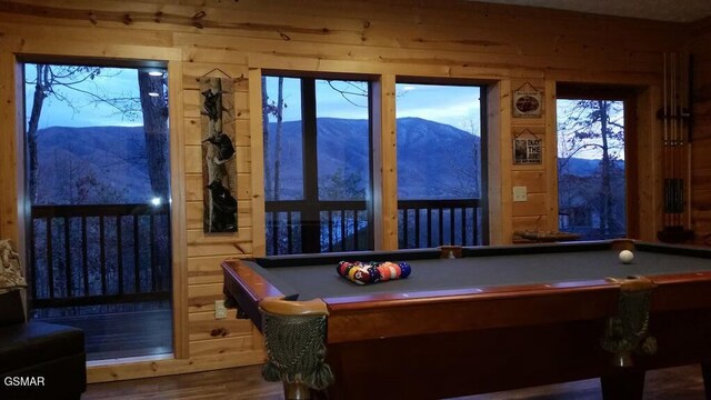 recreation room featuring hardwood / wood-style flooring, a mountain view, and billiards