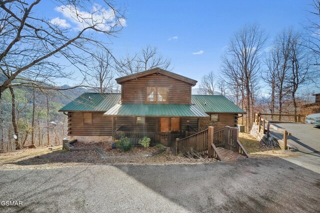 log cabin featuring a porch