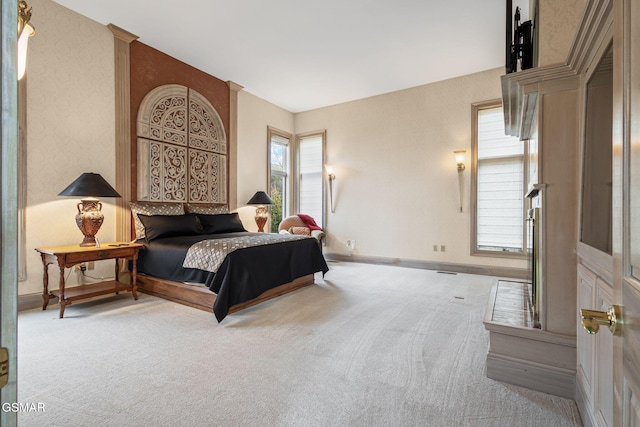 bedroom with carpet flooring and baseboards