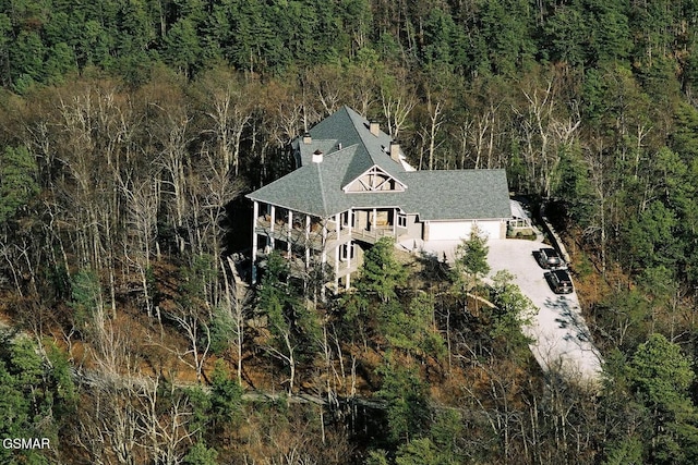 bird's eye view featuring a forest view