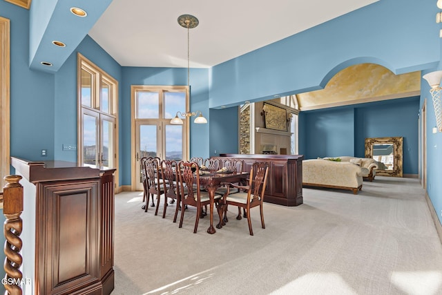 carpeted dining area featuring recessed lighting, a fireplace, and baseboards