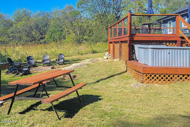 3149 Mutton Hollow Rd, Kodak, TN 37764 - view of green lawn featuring a deck and an outdoor fire pit