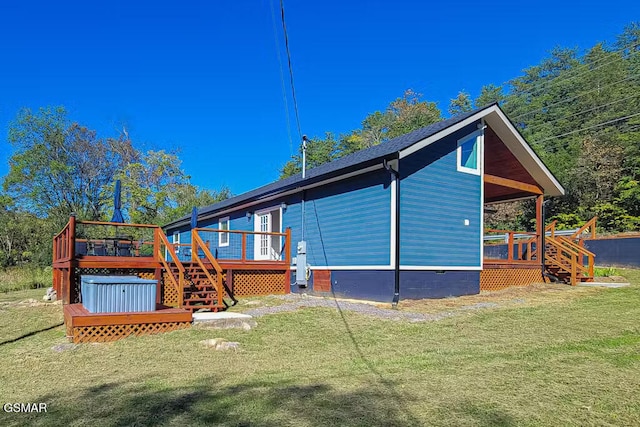3149 Mutton Hollow Rd, Kodak, TN 37764 - back of house with stairs, a wooden deck, and a lawn