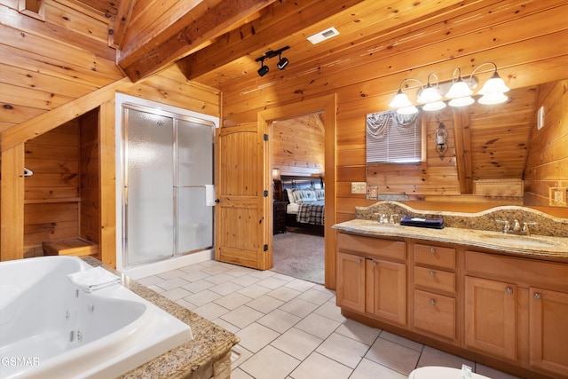 bathroom featuring plus walk in shower, wood walls, beamed ceiling, vanity, and tile patterned floors