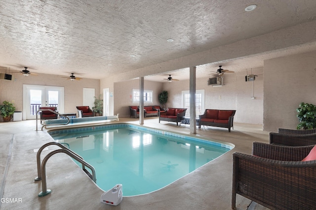 view of pool featuring french doors