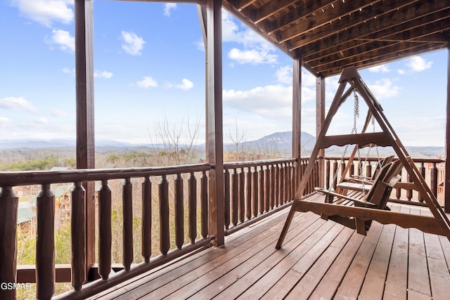 wooden deck with a mountain view