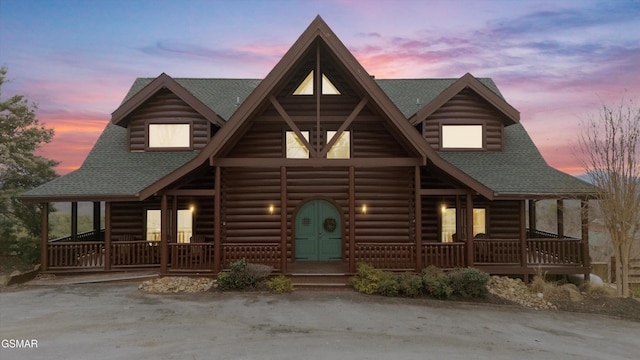 log cabin featuring a porch