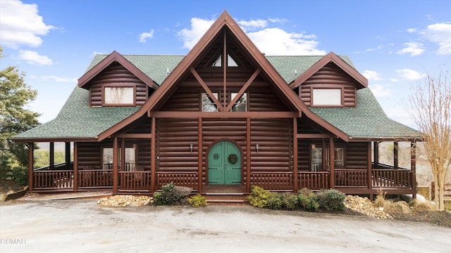 cabin featuring a porch