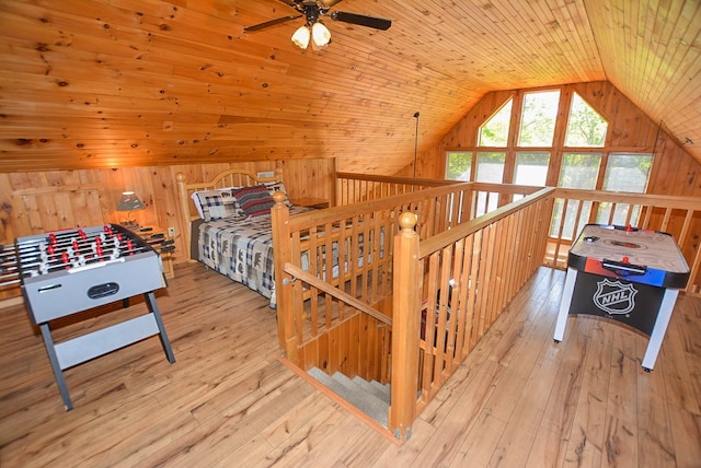 interior space with ceiling fan, light wood-type flooring, wood ceiling, and lofted ceiling