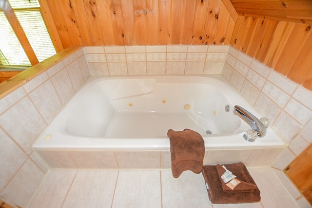 bathroom featuring tile patterned floors and tiled bath