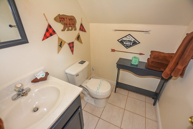 bathroom featuring tile patterned floors, vanity, and toilet