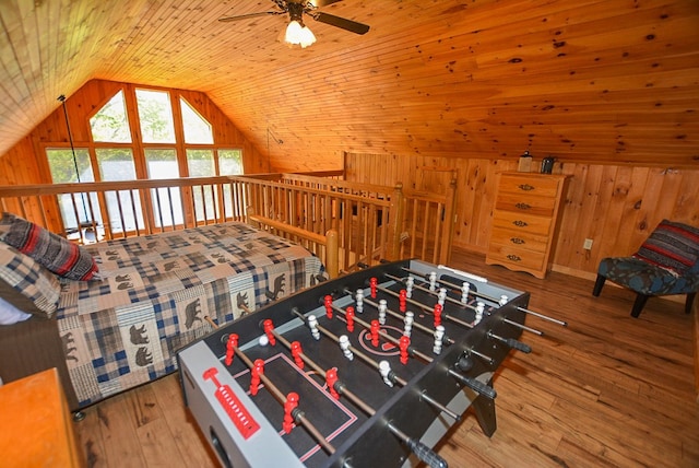 bedroom featuring hardwood / wood-style floors, lofted ceiling, and wood ceiling