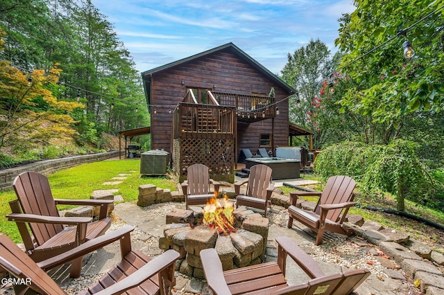 2489 Upper Middle Creek Rd, Sevierville, TN 37876 - patio / terrace with a hot tub, an outdoor fire pit, a patio area, and a lawn