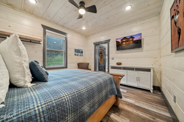 1125 Autumn Path Way, Sevierville, TN 37862 - bedroom with ceiling fan, wood-type flooring, wood walls, and wooden ceiling