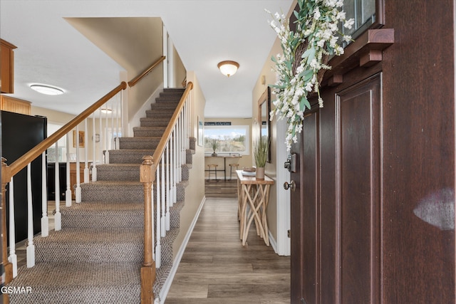 foyer with stairs and wood finished floors