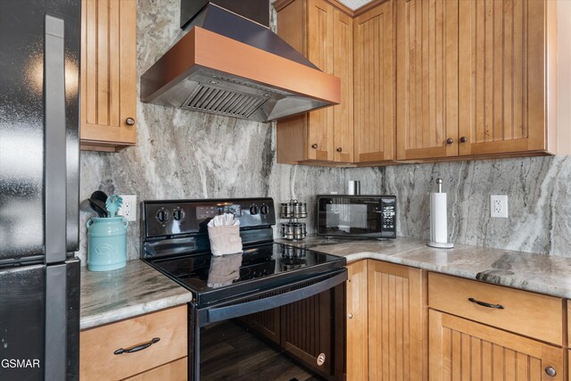 kitchen with decorative backsplash, black appliances, and wall chimney exhaust hood