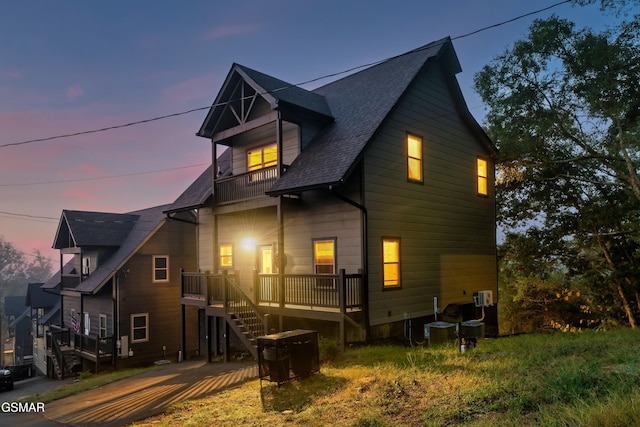 2125 Eagle Feather Dr, Sevierville, TN 37876 - rear view of house with a balcony, roof with shingles, and stairs