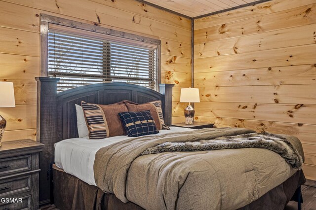 2125 Eagle Feather Dr, Sevierville, TN 37876 - bedroom with wood walls and wood finished floors
